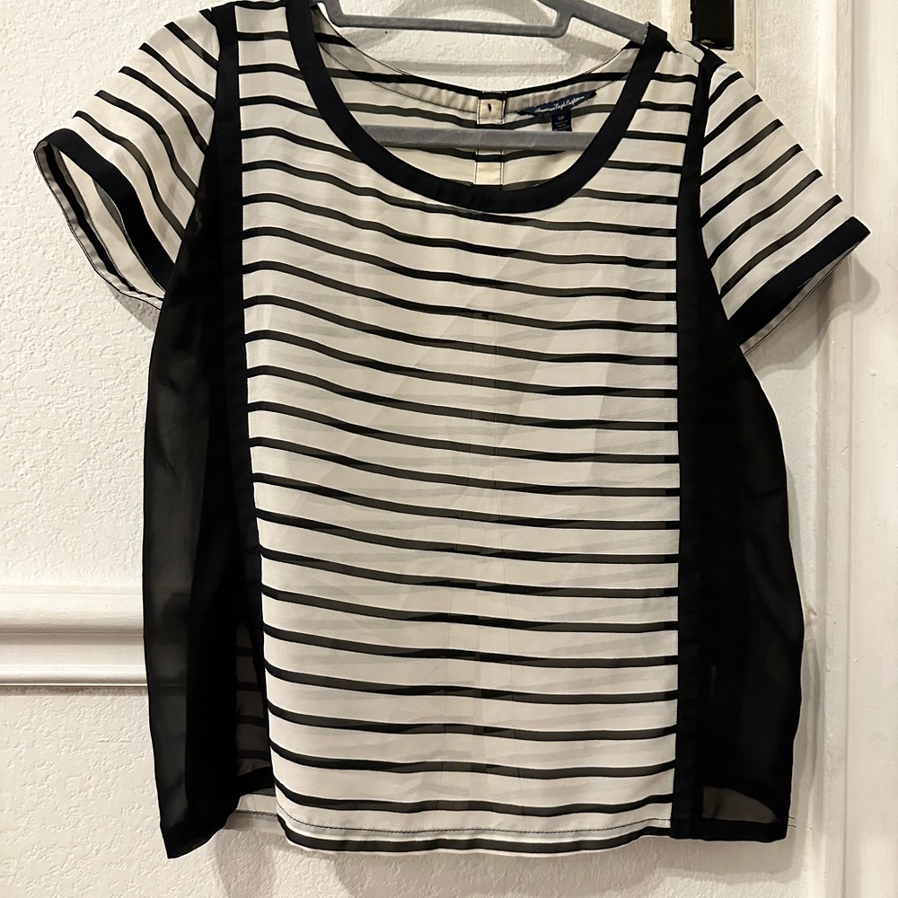 Black and white blouse, in good condition, size small